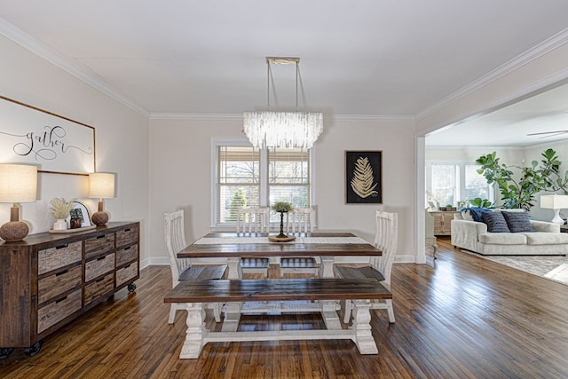 dining area featuring dark hardwood / wood-style flooring, an inviting chandelier, and ornamental molding