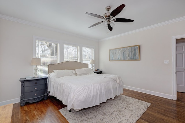 bedroom featuring ornamental molding, ceiling fan, and dark wood-type flooring