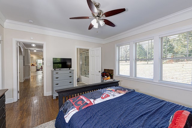 bedroom with ensuite bathroom, ceiling fan, crown molding, and dark wood-type flooring