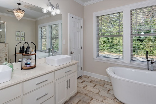 bathroom featuring vanity, a tub to relax in, an inviting chandelier, and ornamental molding