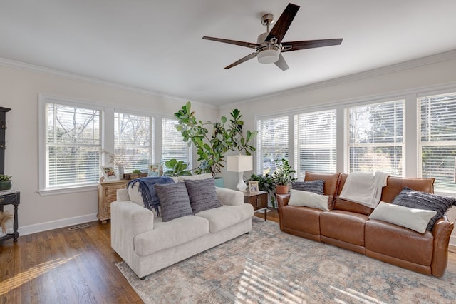 living room featuring hardwood / wood-style floors, ceiling fan, and ornamental molding