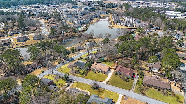 bird's eye view with a water view and a residential view