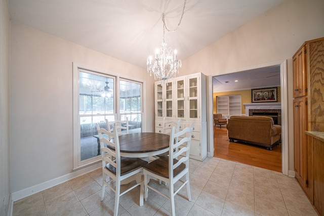 5 Mallard Ct, Midland, GA 31820 - dining space with a chandelier, a fireplace, and light tile patterned floors