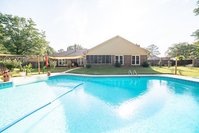 5 Mallard Ct, Midland, GA 31820 - view of swimming pool with a sunroom