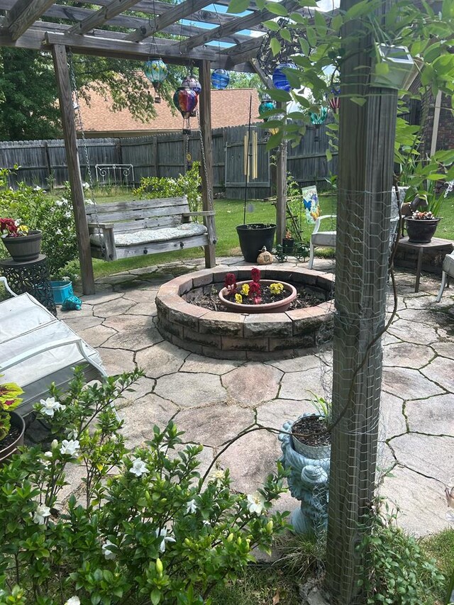 5 Mallard Ct, Midland, GA 31820 - fenced backyard with a patio area, a pergola, and an outdoor fire pit