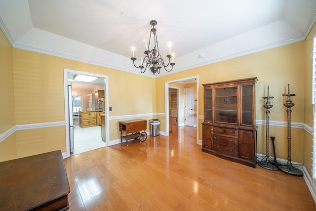 5 Mallard Ct, Midland, GA 31820 - dining room with a tray ceiling, light wood finished floors, and a chandelier