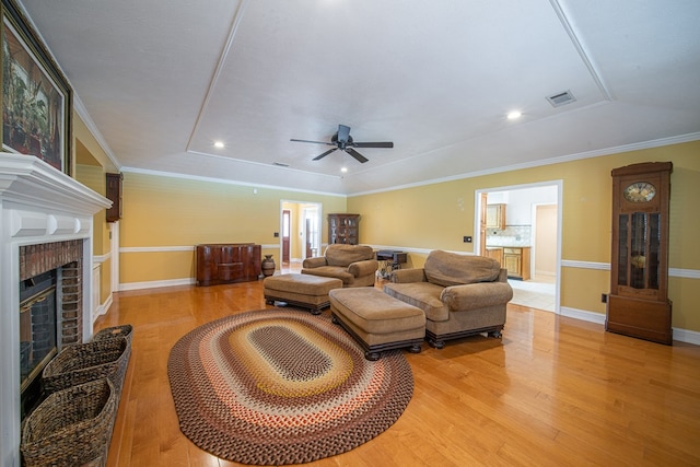 5 Mallard Ct, Midland, GA 31820 - living room with light wood-style floors, a fireplace, ceiling fan, recessed lighting, and crown molding