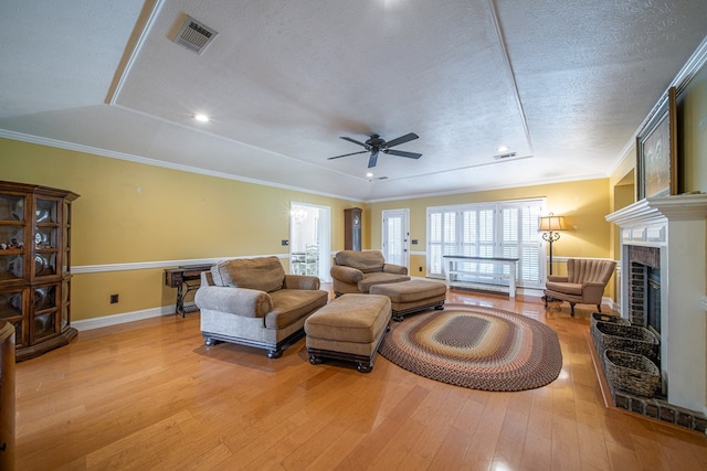5 Mallard Ct, Midland, GA 31820 - living room with light wood-type flooring, a textured ceiling, a ceiling fan, a brick fireplace, and recessed lighting