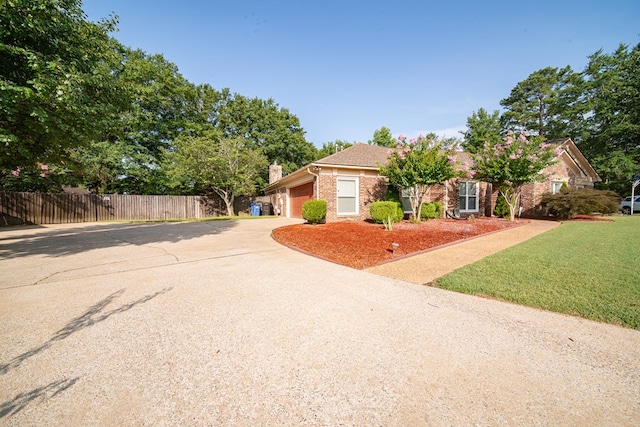 5 Mallard Ct, Midland, GA 31820 - view of front of property with driveway, brick siding, a chimney, and a garage