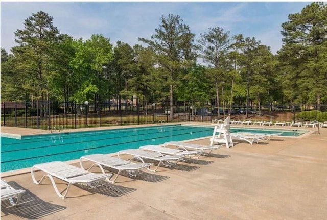 5 Mallard Ct, Midland, GA 31820 - community pool featuring a patio area and view of wooded area