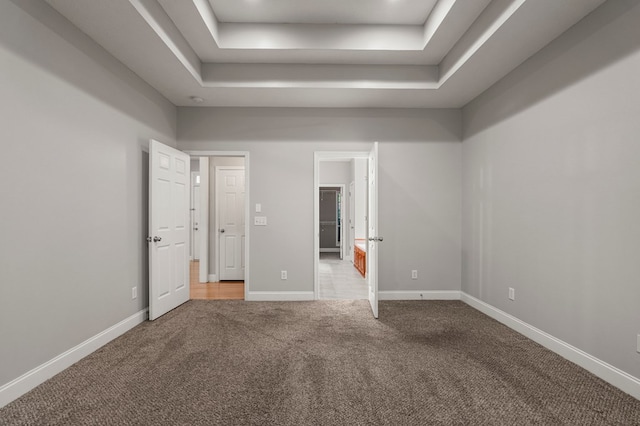 240 Lee Road 2099, Phenix City, AL 36870 - unfurnished bedroom featuring a raised ceiling, carpet, and baseboards