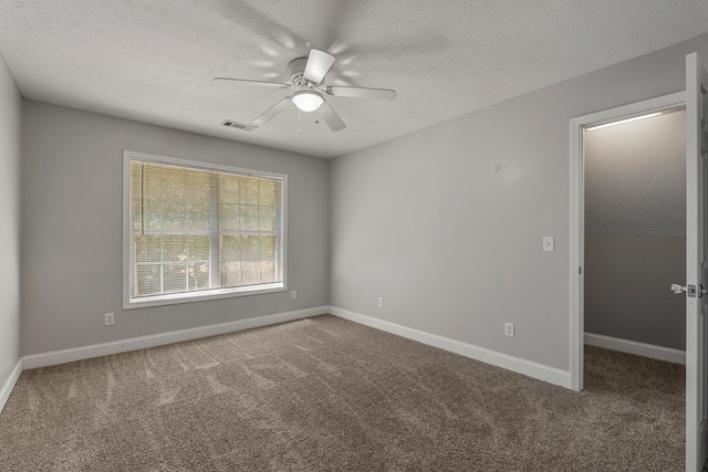 240 Lee Road 2099, Phenix City, AL 36870 - spare room featuring a ceiling fan, a textured ceiling, carpet, and baseboards