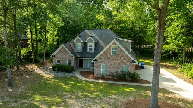 240 Lee Road 2099, Phenix City, AL 36870 - traditional-style house featuring brick siding, concrete driveway, and a front lawn