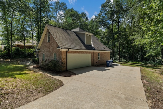 240 Lee Road 2099, Phenix City, AL 36870 - view of property exterior with brick siding, concrete driveway, roof with shingles, and a garage