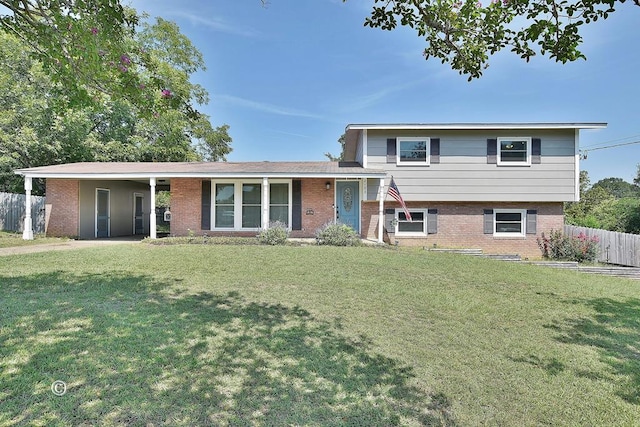 tri-level home with a front yard and a carport