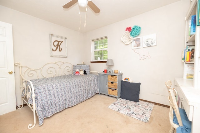 bedroom with a ceiling fan and light carpet