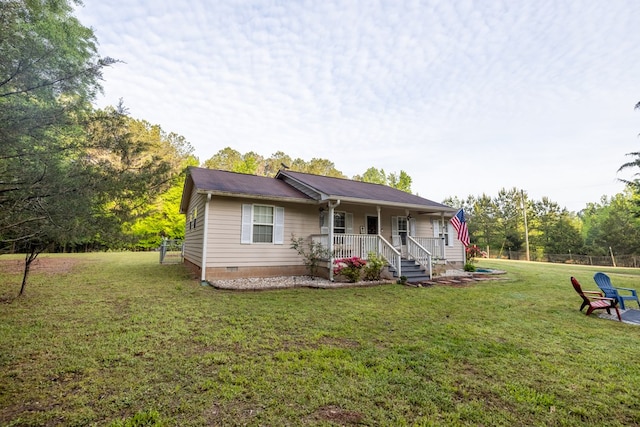 view of front of home with fence, a porch, crawl space, and a front lawn