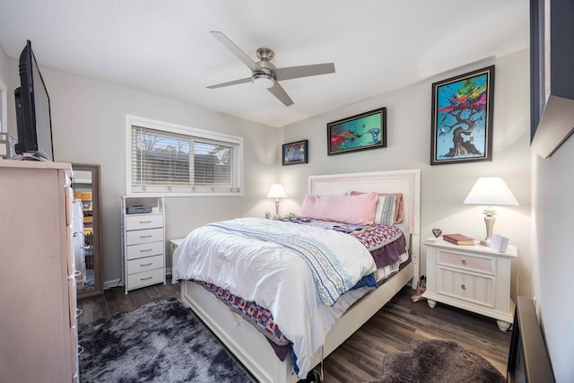 bedroom featuring ceiling fan and dark hardwood / wood-style floors