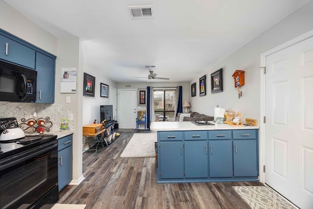 kitchen with decorative backsplash, blue cabinets, ceiling fan, and black appliances