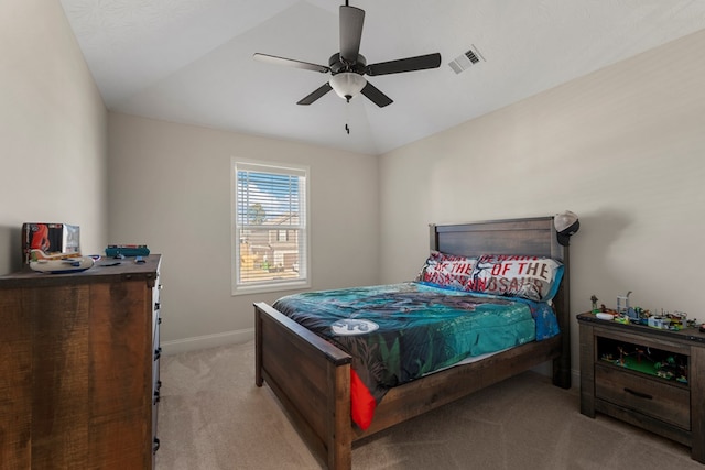 bedroom with lofted ceiling, light carpet, a ceiling fan, visible vents, and baseboards