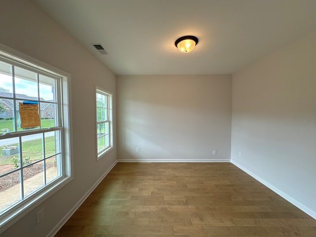 spare room featuring hardwood / wood-style floors