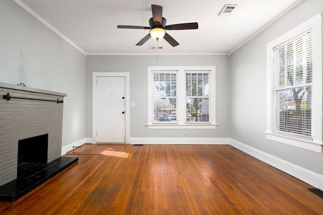 1024 18th St, Columbus, GA 31901 - unfurnished living room featuring hardwood / wood-style floors, healthy amount of natural light, crown molding, a ceiling fan, and a fireplace