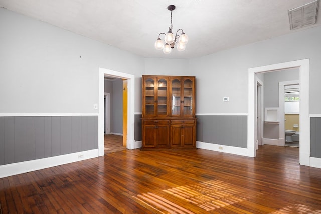 1024 18th St, Columbus, GA 31901 - unfurnished room featuring hardwood / wood-style floors, a chandelier, and wainscoting