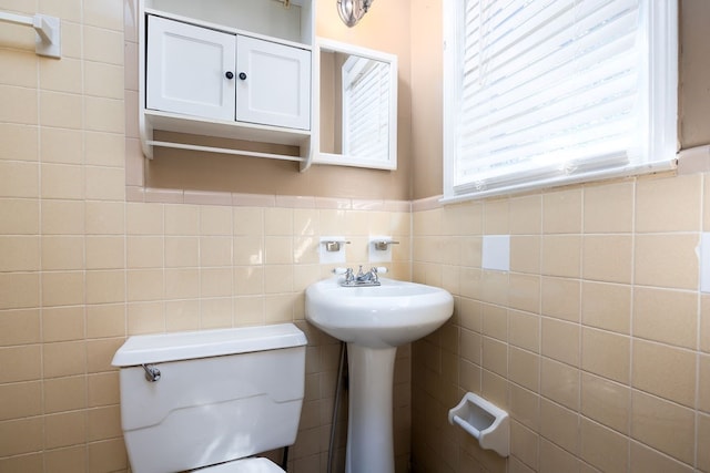 1024 18th St, Columbus, GA 31901 - bathroom featuring tile walls and a wainscoted wall