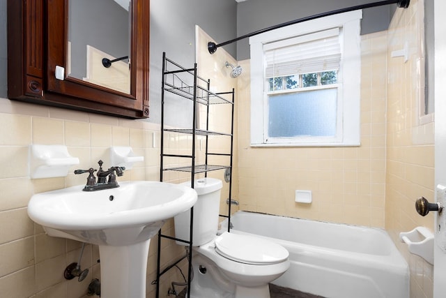 1024 18th St, Columbus, GA 31901 - bathroom with washtub / shower combination and tile walls