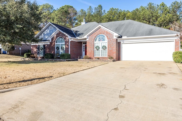 view of front facade with a garage and a front yard