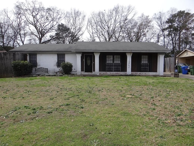 ranch-style house with a front lawn and fence