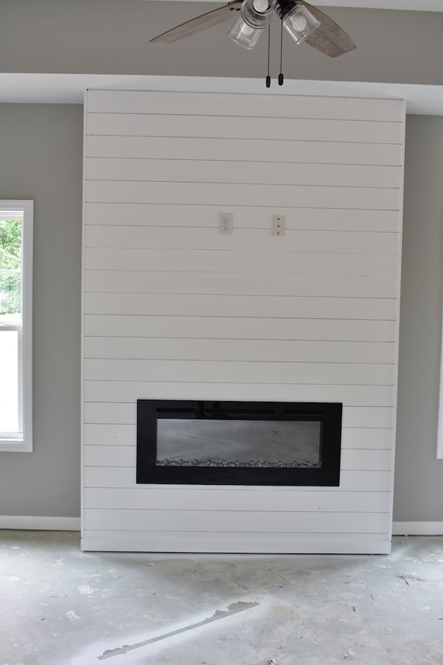 5404 Moon Rd, Columbus, GA 31909 - detailed view of a large fireplace, a ceiling fan, and concrete floors