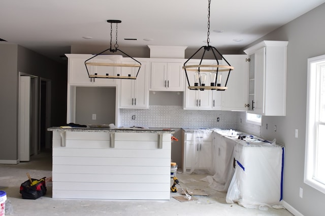 5404 Moon Rd, Columbus, GA 31909 - kitchen with white cabinets, tasteful backsplash, and pendant lighting
