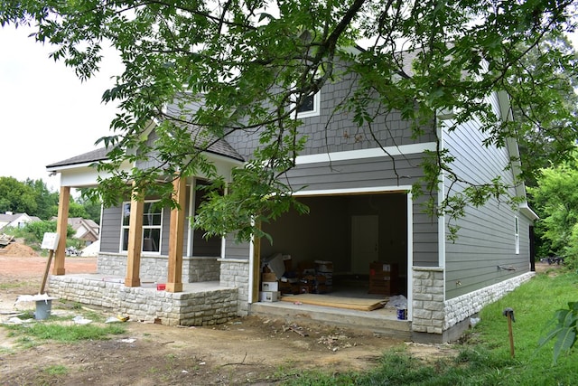 5404 Moon Rd, Columbus, GA 31909 - back of house featuring stone siding and an attached garage