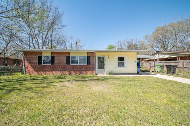1043 Quincy Dr, Columbus, GA 31906 - ranch-style home with driveway, an attached carport, and brick siding