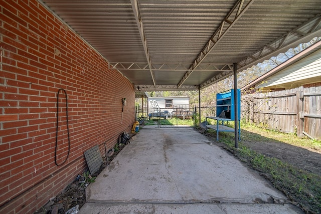 1043 Quincy Dr, Columbus, GA 31906 - view of car parking featuring an attached carport and a gate