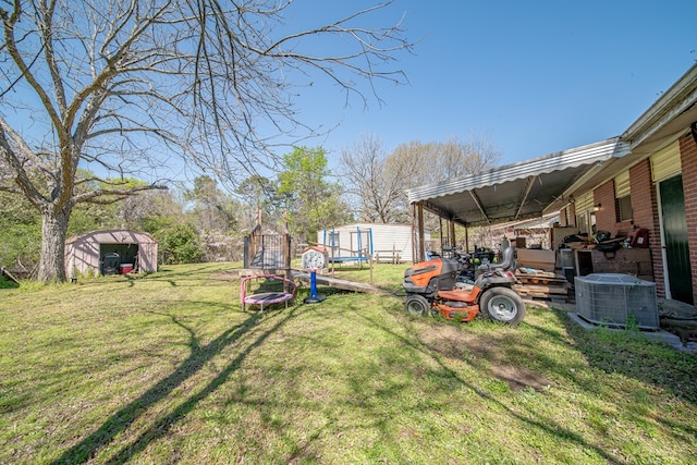 1043 Quincy Dr, Columbus, GA 31906 - view of grassy yard with a storage unit