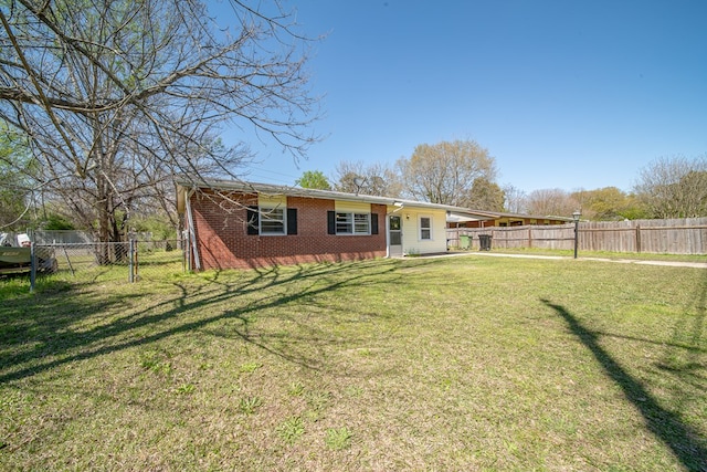 1043 Quincy Dr, Columbus, GA 31906 - view of front of house featuring a fenced backyard and brick siding