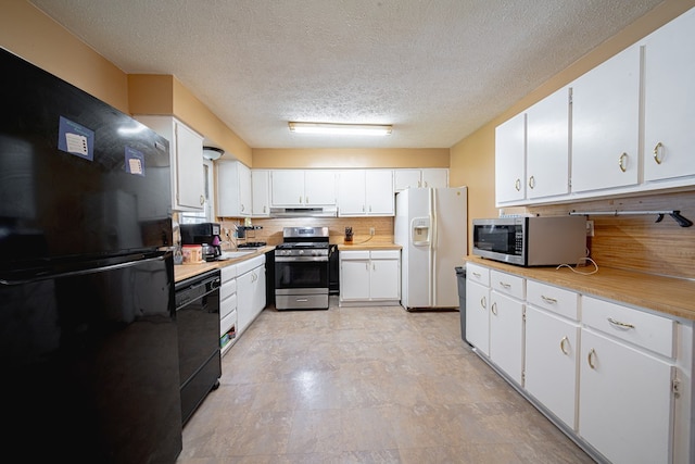 1043 Quincy Dr, Columbus, GA 31906 - kitchen featuring black appliances, under cabinet range hood, a textured ceiling, light countertops, and white cabinets