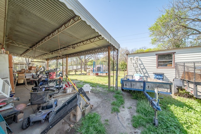 1043 Quincy Dr, Columbus, GA 31906 - view of grassy yard featuring a trampoline