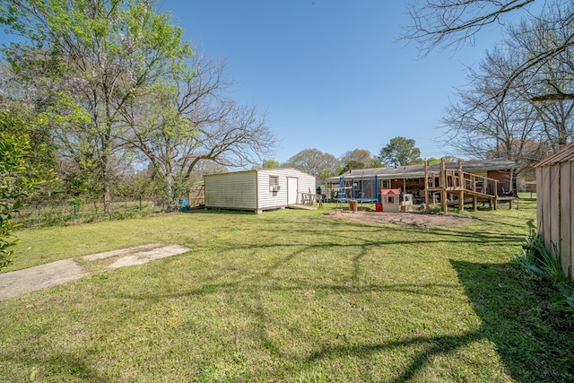 1043 Quincy Dr, Columbus, GA 31906 - view of green lawn with a shed and a trampoline