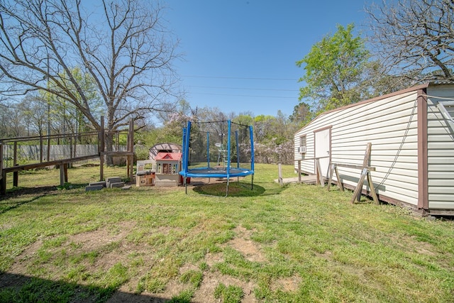 1043 Quincy Dr, Columbus, GA 31906 - view of grassy yard featuring a trampoline and a storage shed