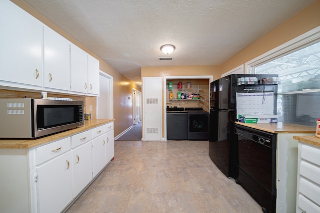 1043 Quincy Dr, Columbus, GA 31906 - kitchen with stainless steel microwave, washer and dryer, dishwasher, a textured ceiling, and light countertops