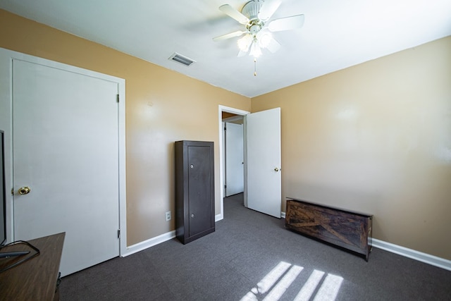 1043 Quincy Dr, Columbus, GA 31906 - unfurnished bedroom featuring dark colored carpet and a ceiling fan