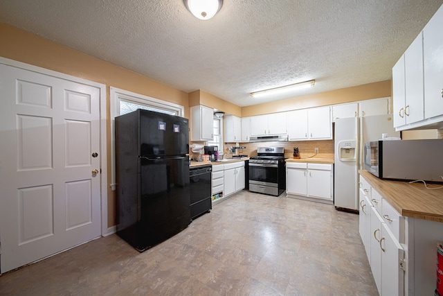 1043 Quincy Dr, Columbus, GA 31906 - kitchen with black appliances, a textured ceiling, white cabinetry, under cabinet range hood, and butcher block counters