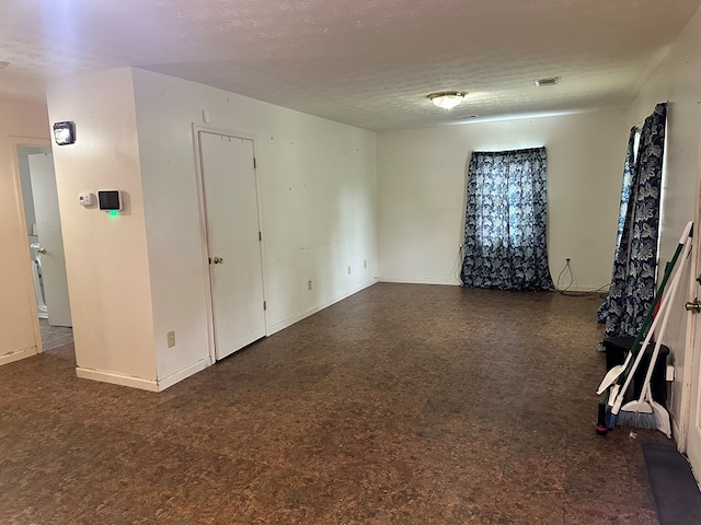 1103 52nd St, Columbus, GA 31904 - spare room with a textured ceiling and baseboards