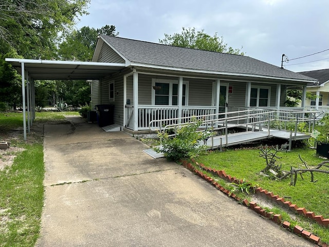 1103 52nd St, Columbus, GA 31904 - view of front of property with concrete driveway, a porch, a carport, and a shingled roof