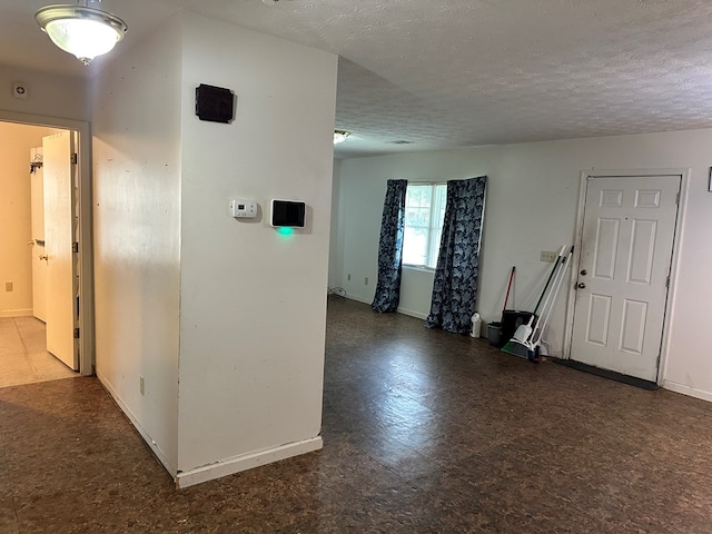 1103 52nd St, Columbus, GA 31904 - hallway with a textured ceiling, tile patterned floors, and baseboards