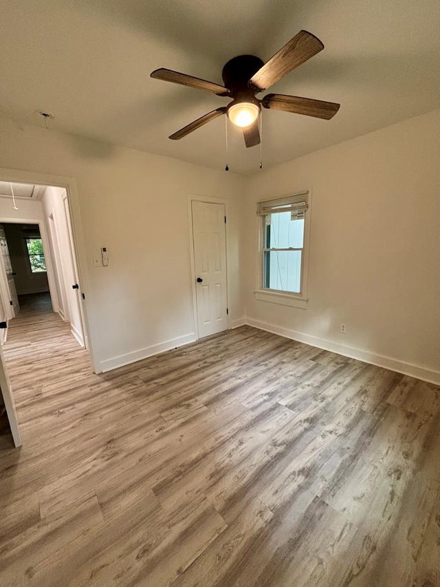 4026 Bowman St, Columbus, GA 31903 - empty room with attic access, wood finished floors, ceiling fan, and healthy amount of natural light