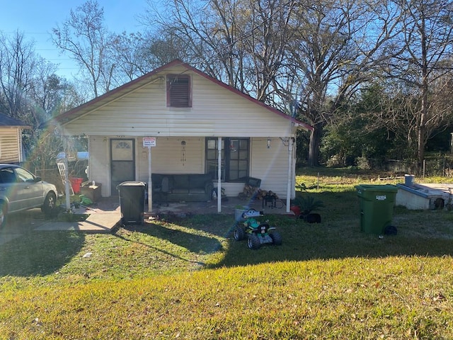 view of front of house featuring a front yard and a porch